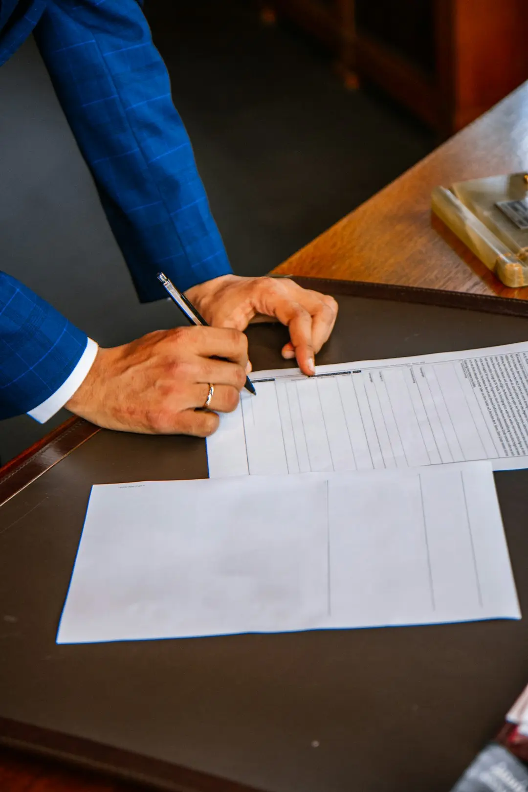 A person signing a contract.